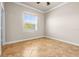 Bright bedroom with a large window, neutral walls, and tile flooring at 5073 Stone Harbor Cir, Wimauma, FL 33598