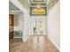 Inviting foyer with high ceilings, elegant lighting, and a glimpse into the adjacent rooms at 5073 Stone Harbor Cir, Wimauma, FL 33598