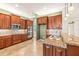 Modern kitchen with granite countertops, stainless appliances, and custom cabinetry at 5073 Stone Harbor Cir, Wimauma, FL 33598