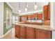 Gourmet kitchen featuring granite countertops, stainless steel appliances and pendant lighting at 5073 Stone Harbor Cir, Wimauma, FL 33598