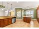Spacious kitchen with an island, granite countertops, stainless steel appliances and lots of cabinets at 5073 Stone Harbor Cir, Wimauma, FL 33598