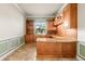 Spacious office with custom wood cabinets, built-in shelving, and ample natural light at 5073 Stone Harbor Cir, Wimauma, FL 33598