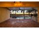 Screened-in pool and hot tub area featuring beautiful sunset view and covered patio at 5073 Stone Harbor Cir, Wimauma, FL 33598