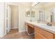 This primary bathroom features a double sink vanity and lots of storage at 5105 Gato Del Sol Cir, Wesley Chapel, FL 33544