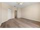This is a secondary bedroom with wood-look floors and lots of closet space at 5105 Gato Del Sol Cir, Wesley Chapel, FL 33544