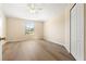 The spacious secondary bedroom is light and bright with a ceiling fan and closet at 5105 Gato Del Sol Cir, Wesley Chapel, FL 33544