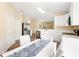 Spacious kitchen offering white cabinets, stainless steel appliances, and an adjacent dining area for casual meals at 5105 Gato Del Sol Cir, Wesley Chapel, FL 33544