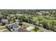 Expansive aerial view of the neighborhood with a golf course, lush trees, and clear skies at 515 34Th Ne Ave, St Petersburg, FL 33704