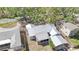 Aerial view of a home with a well-maintained yard, screened porch and carport at 515 34Th Ne Ave, St Petersburg, FL 33704