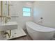 Stylish bathroom with a sleek vanity, soaking tub, and modern fixtures at 515 34Th Ne Ave, St Petersburg, FL 33704