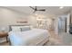 Spacious bedroom with an ensuite bathroom, ceiling fan, and natural light at 515 34Th Ne Ave, St Petersburg, FL 33704