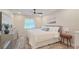 Comfortable bedroom with a ceiling fan, natural light, and stylish decor at 515 34Th Ne Ave, St Petersburg, FL 33704