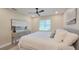 Inviting bedroom with a ceiling fan, a window view, and neutral tones at 515 34Th Ne Ave, St Petersburg, FL 33704
