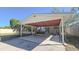 Spacious carport with exposed rafters, concrete flooring and convenient access to the house at 515 34Th Ne Ave, St Petersburg, FL 33704