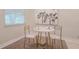 Cozy dining area with a round marble table, modern chairs, and artwork on the wall at 515 34Th Ne Ave, St Petersburg, FL 33704