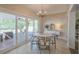 Cozy dining area with a chandelier, patio access, and stylish decor at 515 34Th Ne Ave, St Petersburg, FL 33704