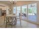 Bright dining area featuring a chandelier, access to the outdoor space, and natural light at 515 34Th Ne Ave, St Petersburg, FL 33704
