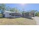 Charming single-story home features a screened porch and covered parking at 515 34Th Ne Ave, St Petersburg, FL 33704