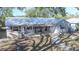 Beautiful single-story home with a pergola-covered porch and manicured yard at 515 34Th Ne Ave, St Petersburg, FL 33704