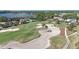 Picturesque aerial shot of a golf course showcasing sand traps and meticulously manicured greens at 515 34Th Ne Ave, St Petersburg, FL 33704
