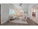 Open-concept living room featuring hardwood floors, neutral paint, contemporary furniture, and natural light at 515 34Th Ne Ave, St Petersburg, FL 33704