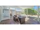 Relaxing screened porch with a comfortable wicker chair and wooden deck at 515 34Th Ne Ave, St Petersburg, FL 33704