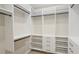Organized walk-in closet with built-in shelves, drawers, and plenty of storage space at 515 34Th Ne Ave, St Petersburg, FL 33704