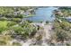Aerial view of waterfront property with docks and boat access on a sunny day at 515 34Th Ne Ave, St Petersburg, FL 33704