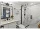 Updated bathroom featuring a vanity, toilet and frameless shower with marble-look tile at 523 Bayport Way # 523, Longboat Key, FL 34228