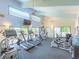 Well-equipped gym with treadmills, weight machines, and views of the outdoors through large windows at 523 Bayport Way # 523, Longboat Key, FL 34228