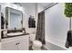 This bathroom features a shower-tub combination, updated fixtures and a vanity with a vessel sink at 5402 Limelight Dr, Apollo Beach, FL 33572