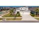 Beautifully landscaped two-story home with a well-manicured lawn and a two-car garage at 5402 Limelight Dr, Apollo Beach, FL 33572