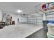 Spacious and organized garage featuring an open garage door, room for parking, and some tools at 5402 Limelight Dr, Apollo Beach, FL 33572