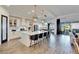 Bright kitchen features a large island with pendant lighting, white cabinetry, and stainless steel appliances at 5402 Limelight Dr, Apollo Beach, FL 33572