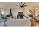 Spacious living room featuring a ceiling fan, stylish decor, and direct access to the dining room and staircase at 5402 Limelight Dr, Apollo Beach, FL 33572