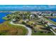 Aerial view of community park with walking trails, covered picnic areas, and playground equipment at 5402 Limelight Dr, Apollo Beach, FL 33572