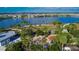 Aerial view of the park with green space, walking paths, and playground, with the lake in the background at 5402 Limelight Dr, Apollo Beach, FL 33572