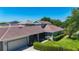 Aerial view of home showcasing the landscaping and screened porch at 6002 Churchside Dr, Lithia, FL 33547