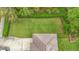Expansive backyard, enhanced by verdant lawn and mature landscaping surrounding the home at 6002 Churchside Dr, Lithia, FL 33547