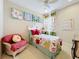 Cozy bedroom with carpeted floors, decorative artwork, and colorful furnishings at 6002 Churchside Dr, Lithia, FL 33547