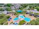 Aerial view of neighborhood pool with splash pad, slides, and lots of seating at 6002 Churchside Dr, Lithia, FL 33547