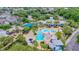 Resort-style pool with slides and multiple seating areas and a covered dining area at 6002 Churchside Dr, Lithia, FL 33547