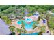 Large pool area with water features, lounge chairs, and lush landscaping at 6002 Churchside Dr, Lithia, FL 33547