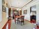 Classic dining room featuring hardwood floors, a chandelier, and elegant decor for refined dining experiences at 6002 Churchside Dr, Lithia, FL 33547