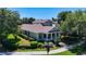 Charming two-story home with a covered front porch and meticulously landscaped front yard at 6002 Churchside Dr, Lithia, FL 33547
