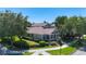 Beautiful home with a welcoming covered porch, surrounded by established trees and garden at 6002 Churchside Dr, Lithia, FL 33547