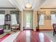 Elegant foyer showcasing hardwood floors and a view of the front yard, flanked by formal living spaces at 6002 Churchside Dr, Lithia, FL 33547