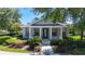 Classic home with a cozy covered porch framed by elegant columns and verdant landscaping at 6002 Churchside Dr, Lithia, FL 33547
