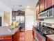 View of the kitchen featuring stainless steel appliances, hardwood floors, and an island with countertop at 6002 Churchside Dr, Lithia, FL 33547