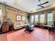 Comfortable living room featuring a sofa, chairs, hardwood floors, and a decorative rug at 6002 Churchside Dr, Lithia, FL 33547
